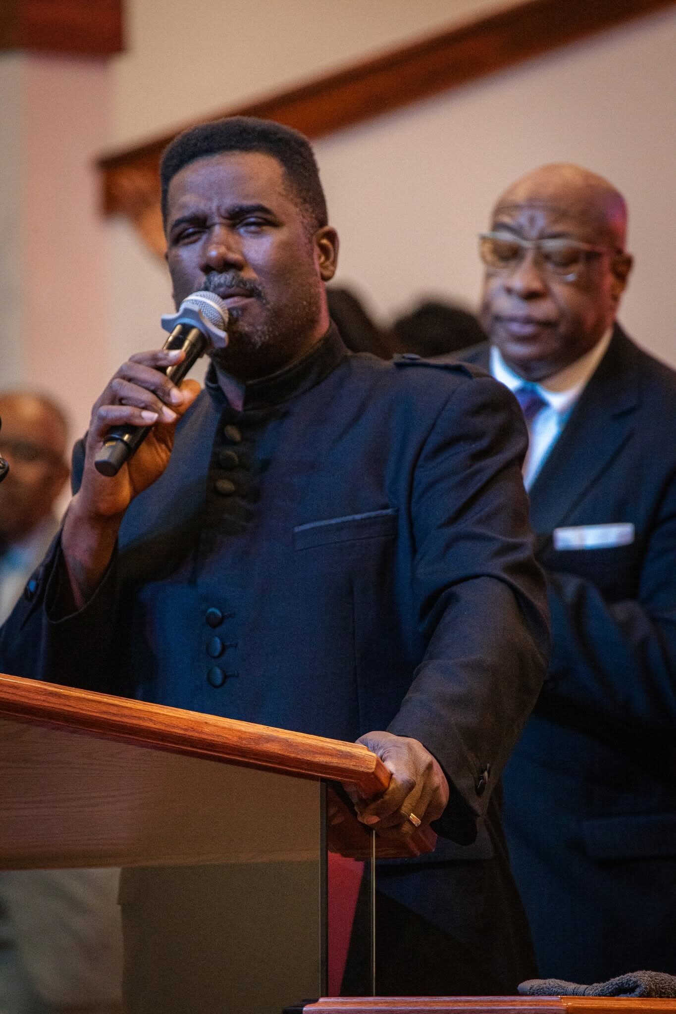 Bishop G. F. Austin III preaching passionately from the pulpit